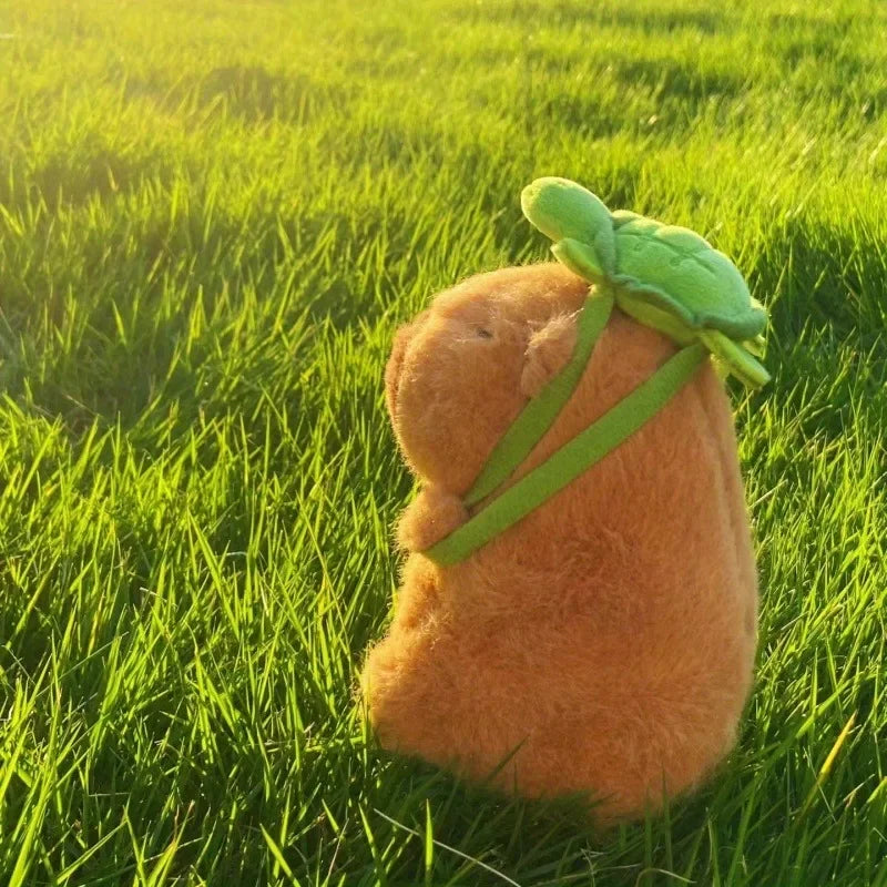 Strawberry hat and Turtle backpack capybara