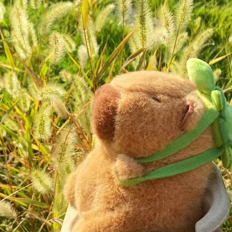 Strawberry hat and Turtle backpack capybara